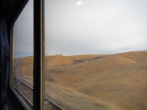 A long house alone on a rise in the middle of nowhere